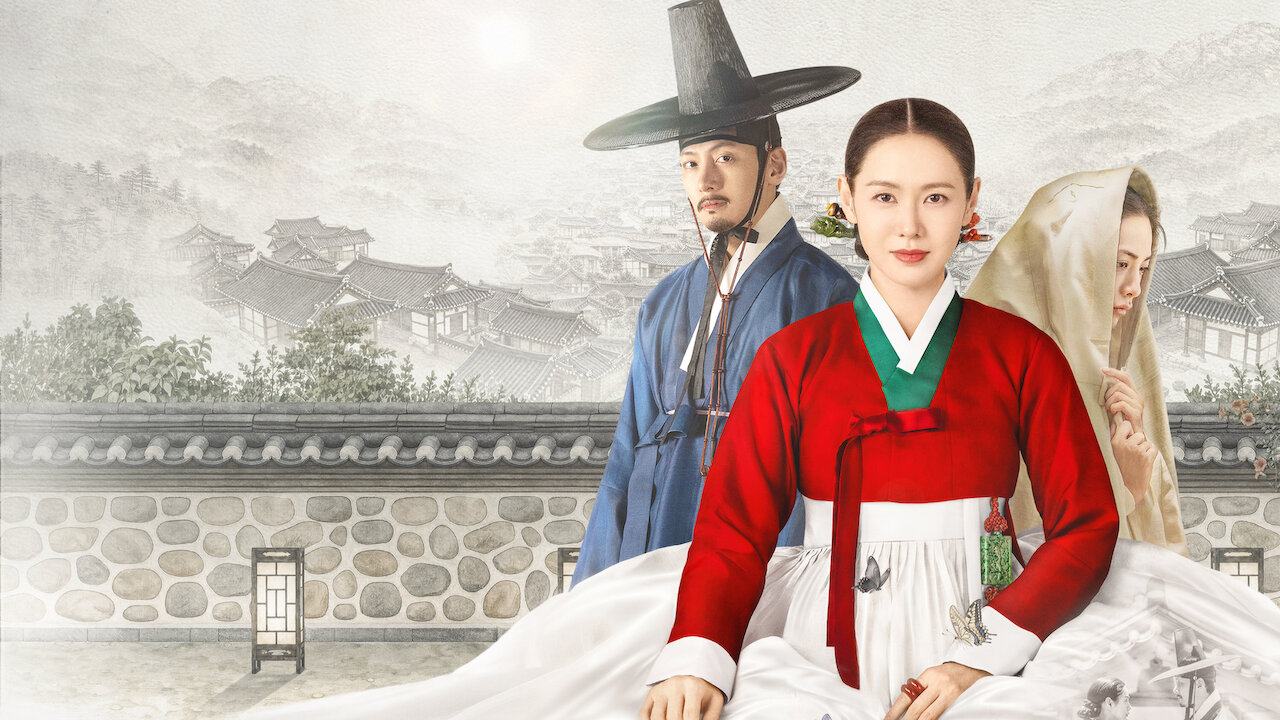 Son Ye-jin de hanbok vermelho sentada à frente de Ji Chang-wook e NANA em arte oficial de Escândalo e Intriga